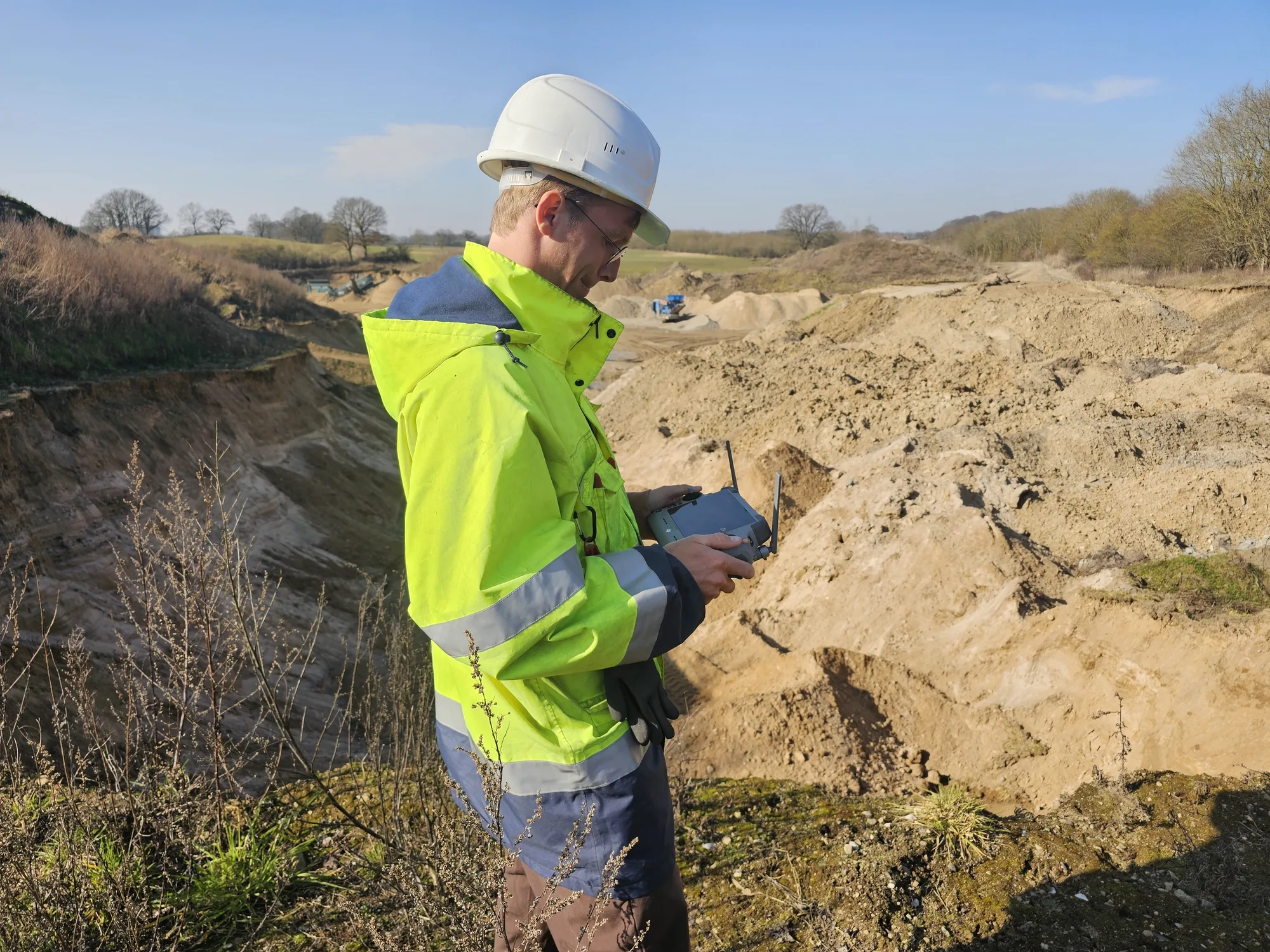 Sachtleben drone pilot flying an RTK survey over a sand quarry