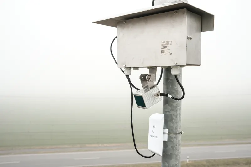 OWL EYE® stockpile platform with stainless steel weather hood and Made-in-Germany type label — weatherproof outdoor mount